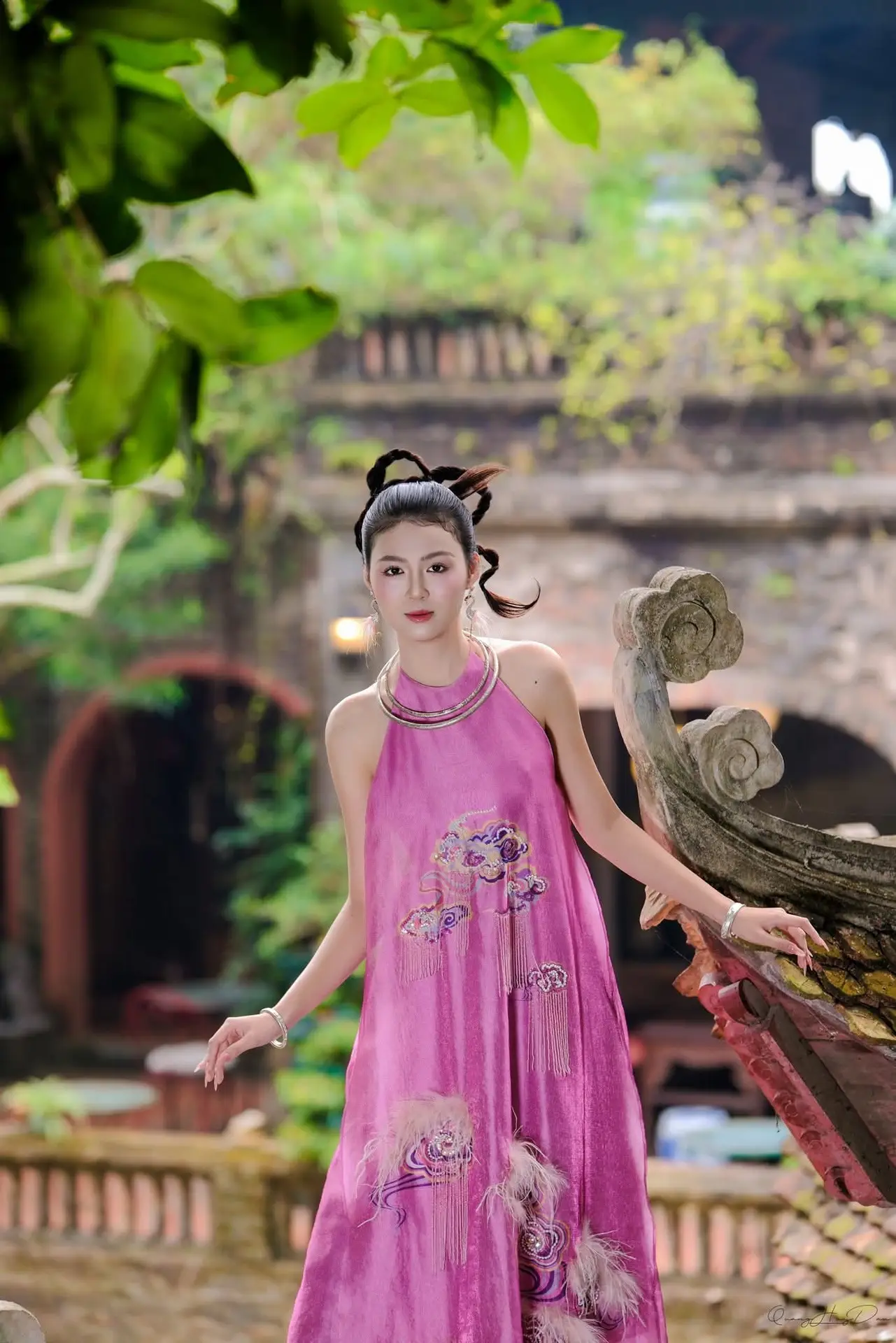 Timeless Grace: Vietnamese Woman's Modern Elegance Amidst Ancient Architecture.