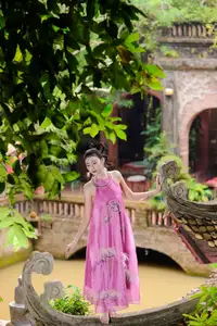 Timeless Grace: Vietnamese Woman's Modern Elegance Amidst Ancient Architecture. - image 1