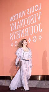 Lisa of Blackpink stuns with bold hippie curls at an international fashion event - image 8