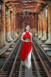 Asian Beauty: Graceful Woman in Traditional Red Dress, Radiant Charm - image 2