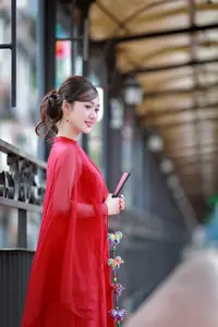 Asian Beauty: Graceful Woman in Traditional Red Dress, Radiant Charm - image 1