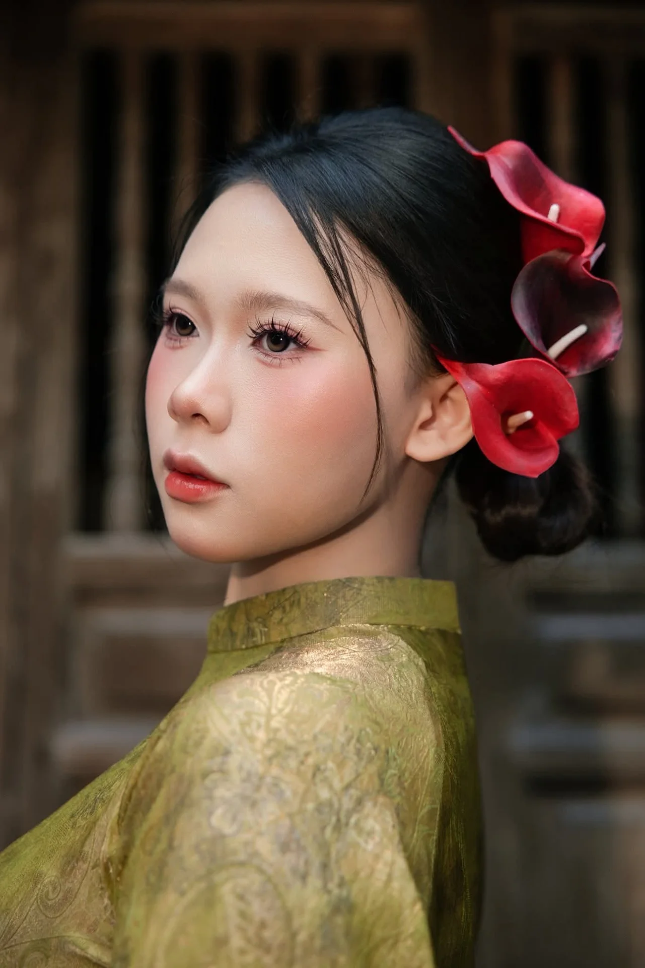 Graceful Vietnamese Ao Dai: Traditional Beauty Adorned with Red Calla Lilies
