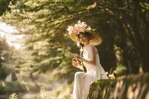 Serene Vietnamese Beauty in White Ao Dai with Lilies: A Golden Hour Portrait 1000025192 - image 3