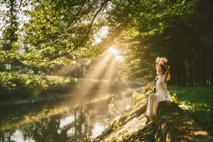 Serene Vietnamese Beauty in White Ao Dai with Lilies: A Golden Hour Portrait 1000025192 - image 8