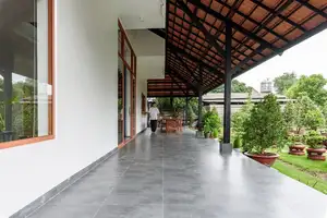 Explore Modern Tiled Roof House: Traditional charm meets green living, ideal architecture for a peaceful retirement. - image 0