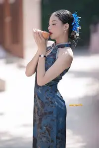 Captivating Asian Beauty: Elegant Woman in Blue Cheongsam with Traditional Fan - image 9