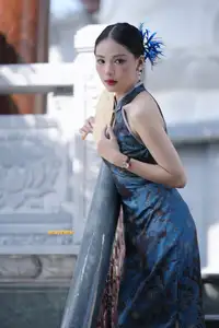 Captivating Asian Beauty: Elegant Woman in Blue Cheongsam with Traditional Fan - image 8