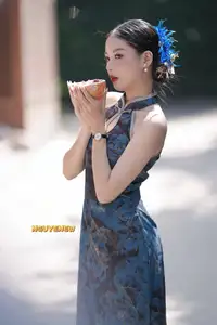 Captivating Asian Beauty: Elegant Woman in Blue Cheongsam with Traditional Fan - image 11