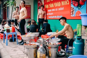 Shirtless Muscular Servers in Vietnam Coffee Shop Spark Heated Online Debate - image 2