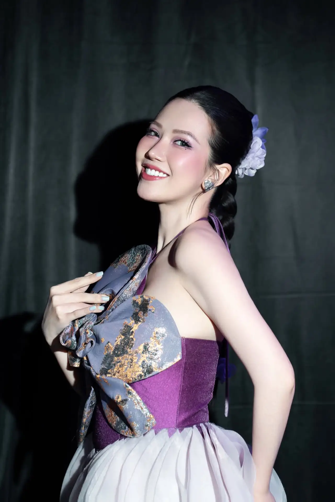Radiant Actress in Elegant Stage Costume, Her Graceful Beauty Captivates Every Gaze on Stage.