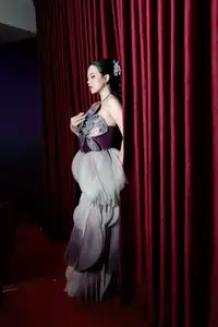 Radiant Actress in Elegant Stage Costume, Her Graceful Beauty Captivates Every Gaze on Stage. - image 4