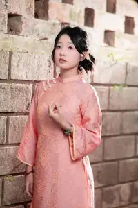 Graceful Asian Young Woman in Traditional Pink Attire: Timeless Beauty by an Ancient Wall - image 4