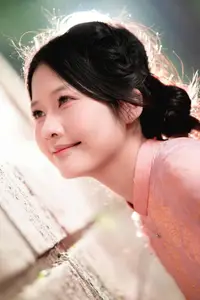 Graceful Asian Young Woman in Traditional Pink Attire: Timeless Beauty by an Ancient Wall - image 7