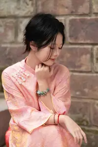Graceful Asian Young Woman in Traditional Pink Attire: Timeless Beauty by an Ancient Wall - image 3