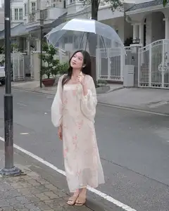 Girl in Floral Off-Shoulder Dress, Clear Umbrella: Fresh Summer Street Style - image 1