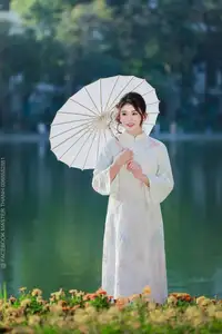 Enchanting East Asian Beauty: A Serene Muse in White Cheongsam under Soft Sunlight by the Lake. - image 4