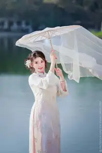Enchanting East Asian Beauty: A Serene Muse in White Cheongsam under Soft Sunlight by the Lake. - image 0