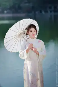 Enchanting East Asian Beauty: A Serene Muse in White Cheongsam under Soft Sunlight by the Lake. - image 1