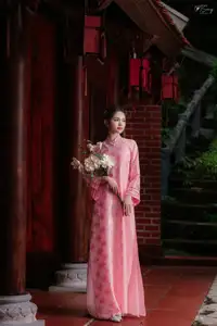 Pink Ao Dai Charm: Discover the Ethereal Beauty of Vietnamese Women in Ancient Heritage Settings. - image 7