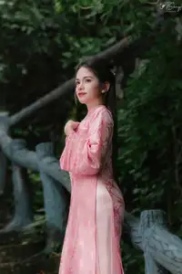 Pink Ao Dai Charm: Discover the Ethereal Beauty of Vietnamese Women in Ancient Heritage Settings. - image 2