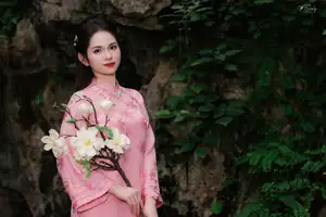 Pink Ao Dai Charm: Discover the Ethereal Beauty of Vietnamese Women in Ancient Heritage Settings. - image 1