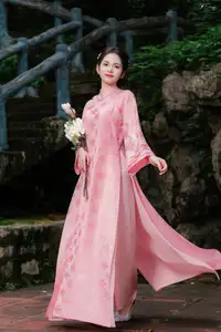 Pink Ao Dai Charm: Discover the Ethereal Beauty of Vietnamese Women in Ancient Heritage Settings. - image 4