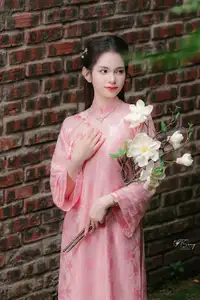 Pink Ao Dai Charm: Discover the Ethereal Beauty of Vietnamese Women in Ancient Heritage Settings. - image 6