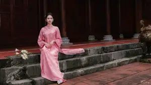 Pink Ao Dai Charm: Discover the Ethereal Beauty of Vietnamese Women in Ancient Heritage Settings. - image 3