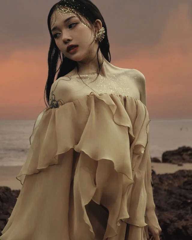 Linh Ngoc Dam Embraces Elegant Feminine Style with Delicate Shoulder-Baring Outfits