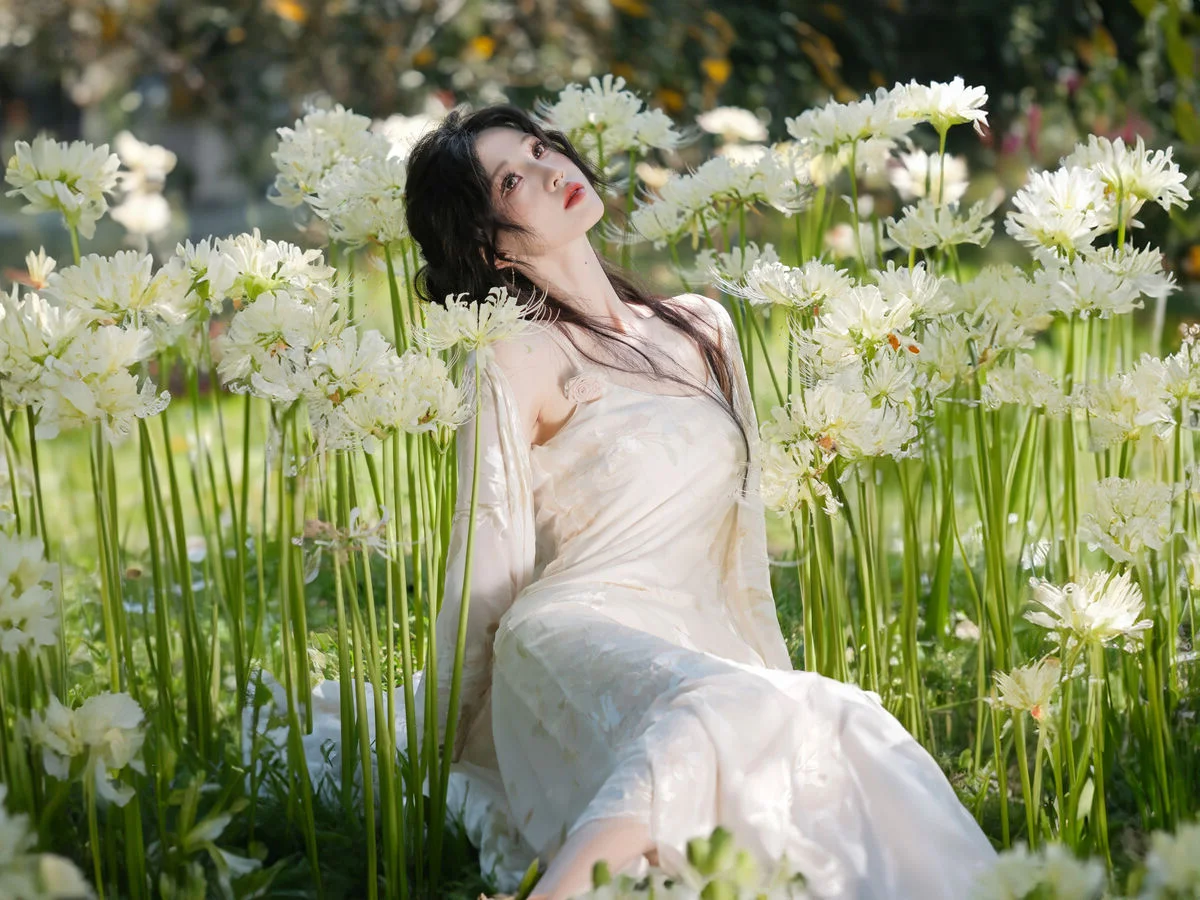 Ethereal Beauty in a White Flower Field: A Muse Under the Sun
