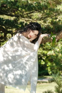 Ethereal Beauty in a White Flower Field: A Muse Under the Sun - image 1
