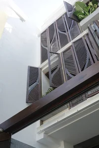 Modern Eco-Friendly Home Design Inspired by Tropical Coconut Leaves in Ho Chi Minh City: A Sustainable Architectural Masterpiece with Split-Level Living - image 4