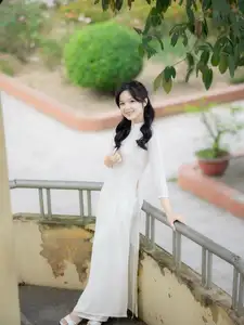 Discover the Timeless Charm of a Vietnamese Girl in Elegant White Ao Dai - image 5