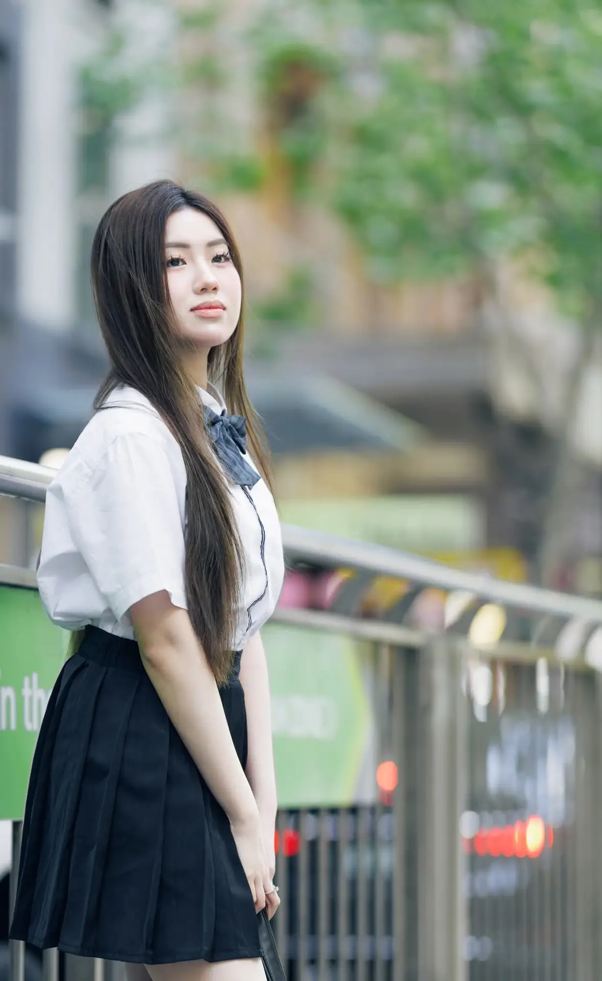Charming Schoolgirl Embraces Street Style with Classic Uniform.