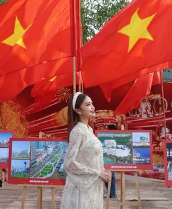 Vietnamese Pageant Queens Celebrate Reunification Day in Traditional Red Ao Dai - image 11