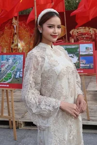 Vietnamese Pageant Queens Celebrate Reunification Day in Traditional Red Ao Dai - image 16