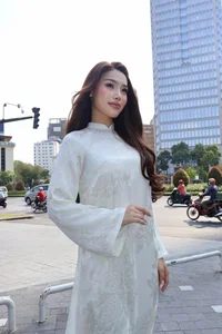 Vietnamese Pageant Queens Celebrate Reunification Day in Traditional Red Ao Dai - image 0