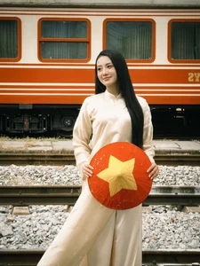 Vietnamese Pageant Queens Celebrate Reunification Day in Traditional Red Ao Dai - image 12