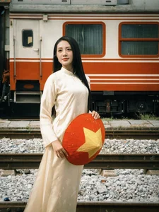 Vietnamese Pageant Queens Celebrate Reunification Day in Traditional Red Ao Dai - image 7