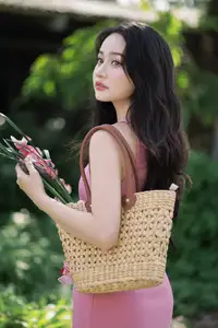 Captivating Grace: Long-Haired Beauty in Soft Pink Evokes Dreamy Serenity. - image 3