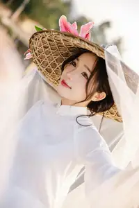 Discover the captivating grace of a Vietnamese woman in a flowing white Ao Dai and traditional conical hat - image 16