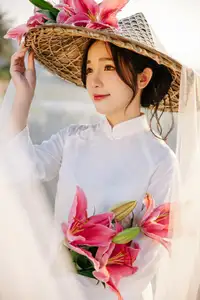 Discover the captivating grace of a Vietnamese woman in a flowing white Ao Dai and traditional conical hat - image 14