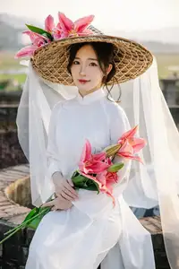 Discover the captivating grace of a Vietnamese woman in a flowing white Ao Dai and traditional conical hat - image 7