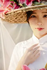 Discover the captivating grace of a Vietnamese woman in a flowing white Ao Dai and traditional conical hat - image 19