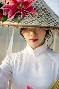 Discover the captivating grace of a Vietnamese woman in a flowing white Ao Dai and traditional conical hat - image 6
