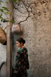 Elegant Asian Beauty: Serene Woman in Modernized Traditional Dress with Vintage Floral Vase - image 8