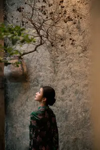 Elegant Asian Beauty: Serene Woman in Modernized Traditional Dress with Vintage Floral Vase - image 5