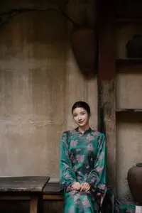 Elegant Asian Beauty: Serene Woman in Modernized Traditional Dress with Vintage Floral Vase - image 6