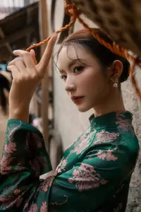 Elegant Asian Beauty: Serene Woman in Modernized Traditional Dress with Vintage Floral Vase - image 4