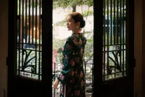 Elegant Asian Beauty: Serene Woman in Modernized Traditional Dress with Vintage Floral Vase - image 15